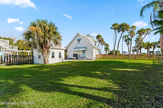 a bathroom with a sink shower and a mirror