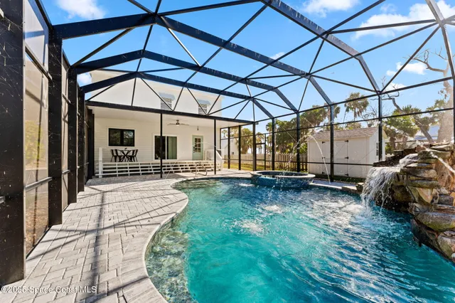 a spacious bathroom with a double vanity sink a large mirror and a bathtub