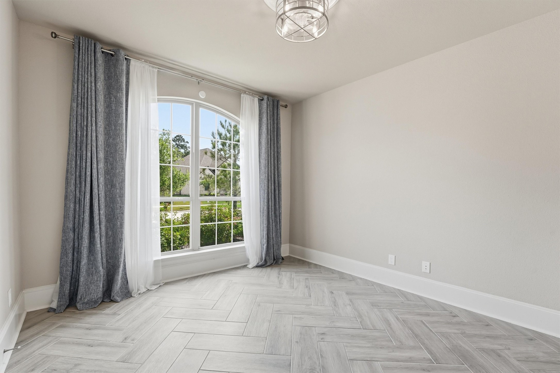 8673 Burdekin Road Magnolia, TX 77354 - Photo 6 of 50 Study has porcelain tile, ceiling fan, and French Doors.