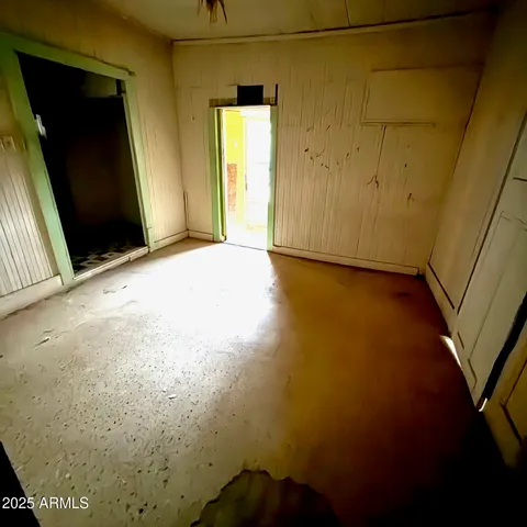 a bathroom with a black and white checkered floor