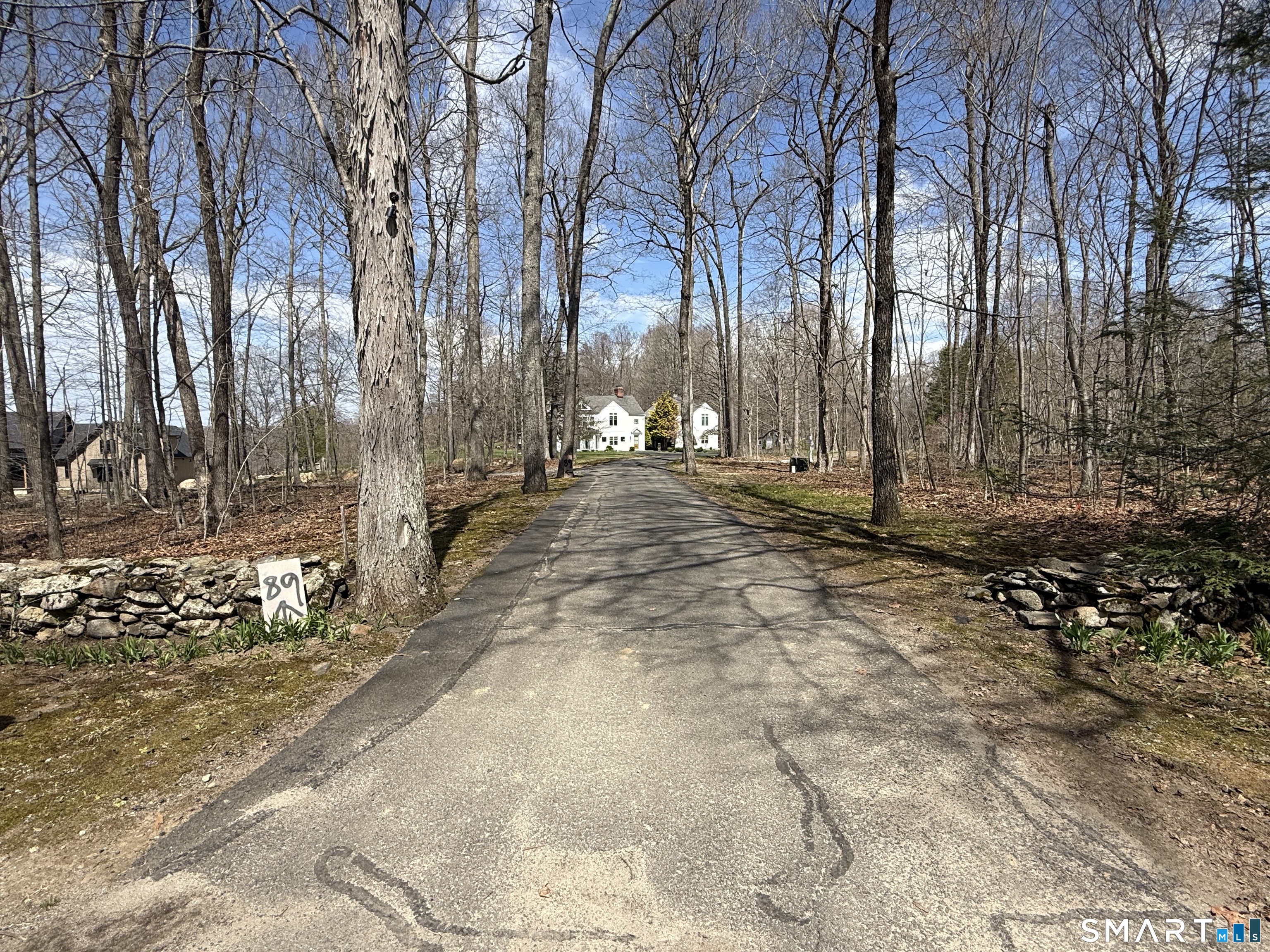 96 Quail Run Road Woodbury, CT 06798 - Photo 7 of 11 Pulling up the common driveway before it branches off to your own driveway to #96