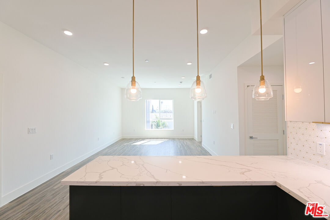 4000 Mont Clair Street, Unit 201 Los Angeles, CA 90018 - Photo 12 of 21 a bathroom with a bathtub and a shower