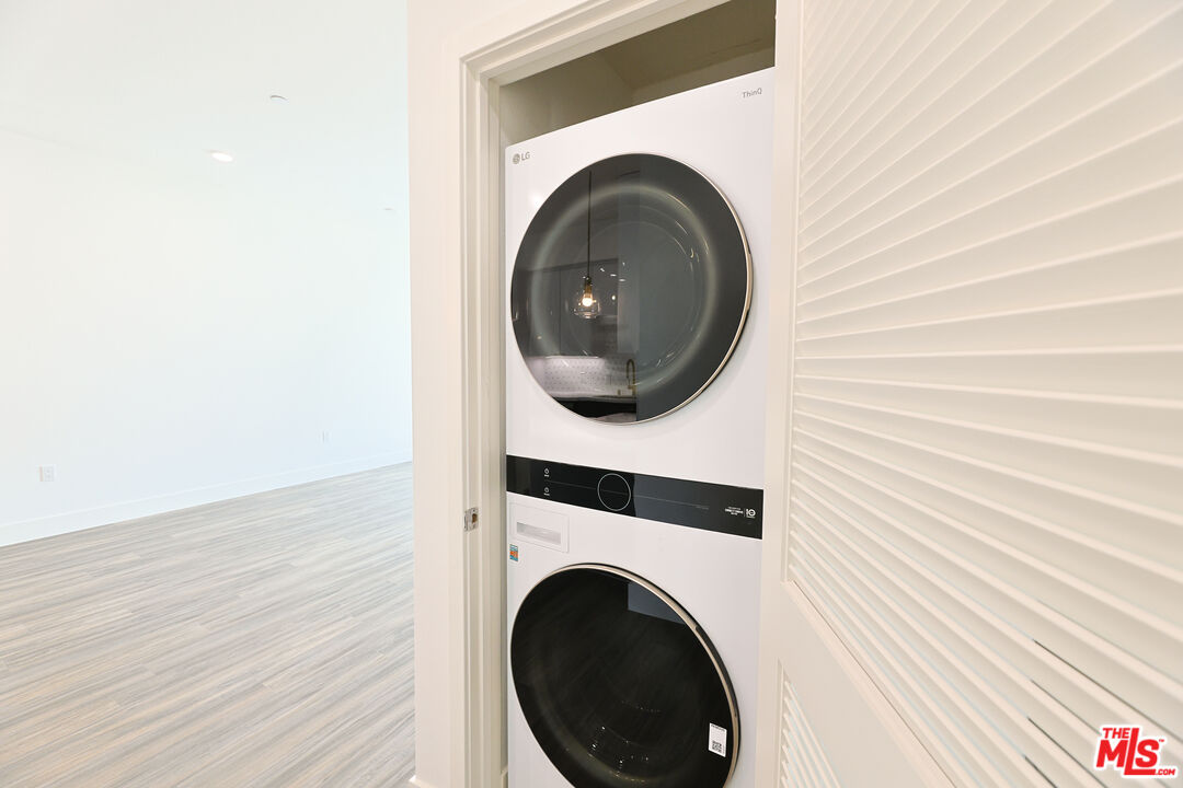 4000 Mont Clair Street, Unit 201 Los Angeles, CA 90018 - Photo 17 of 21 a close up view of a washer and dryer