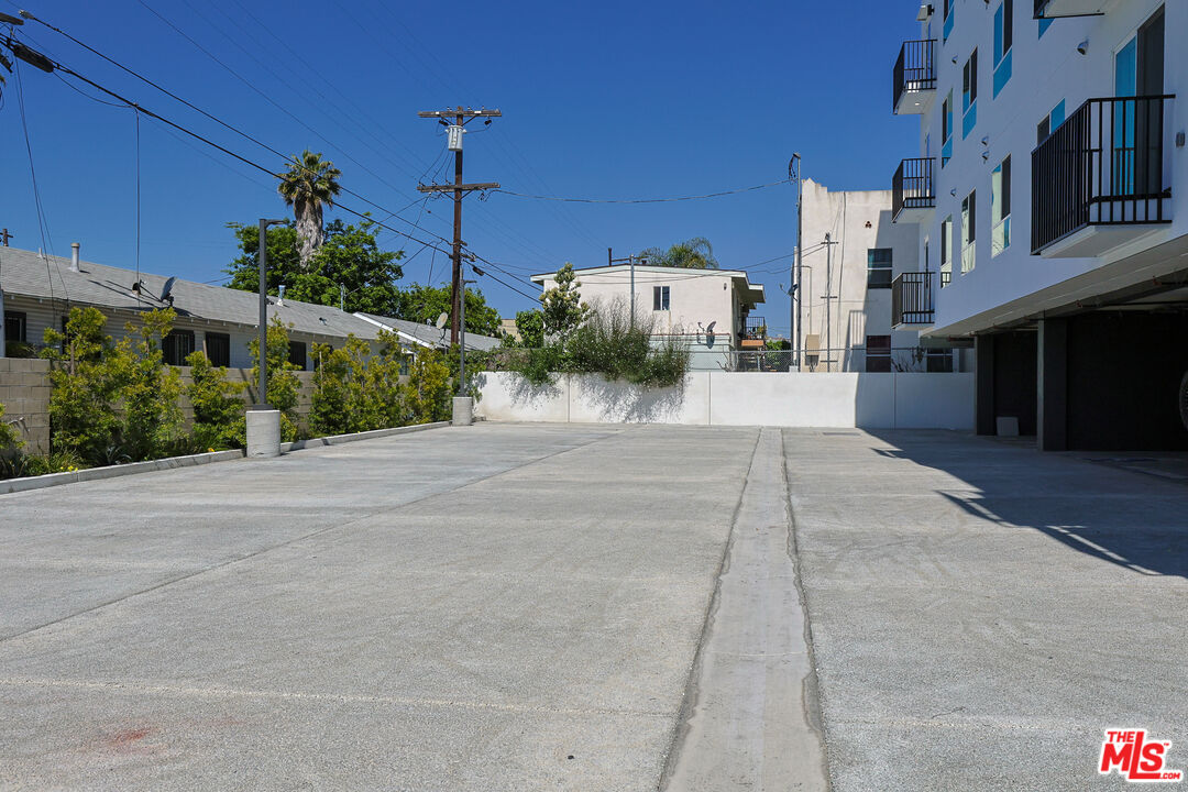 4000 Mont Clair Street, Unit 201 Los Angeles, CA 90018 - Photo 20 of 21 a road view of a building