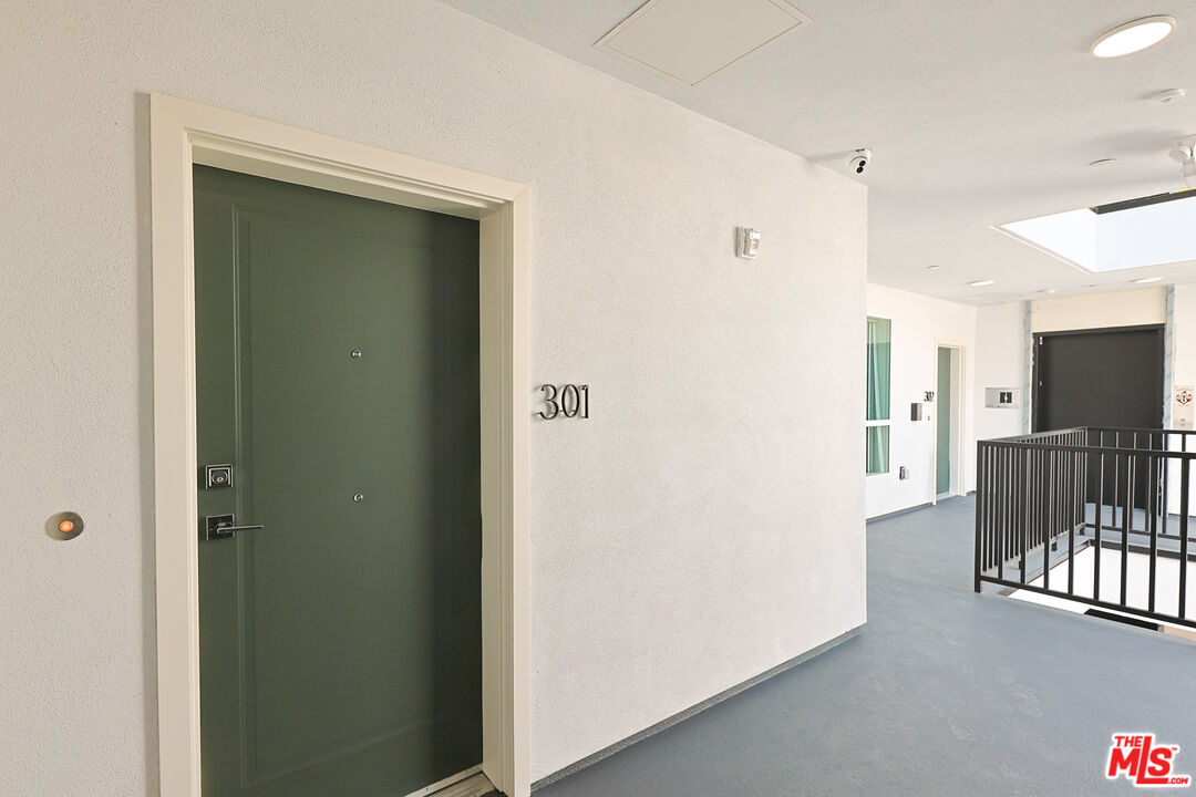 4000 Mont Clair Street, Unit 201 Los Angeles, CA 90018 - Photo 3 of 21 a view of a hallway with a elevator