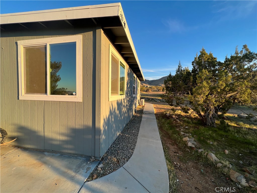 20240 Juniper Road Apple Valley, CA 92308 - Photo 15 of 25 a view of a pathway of a house