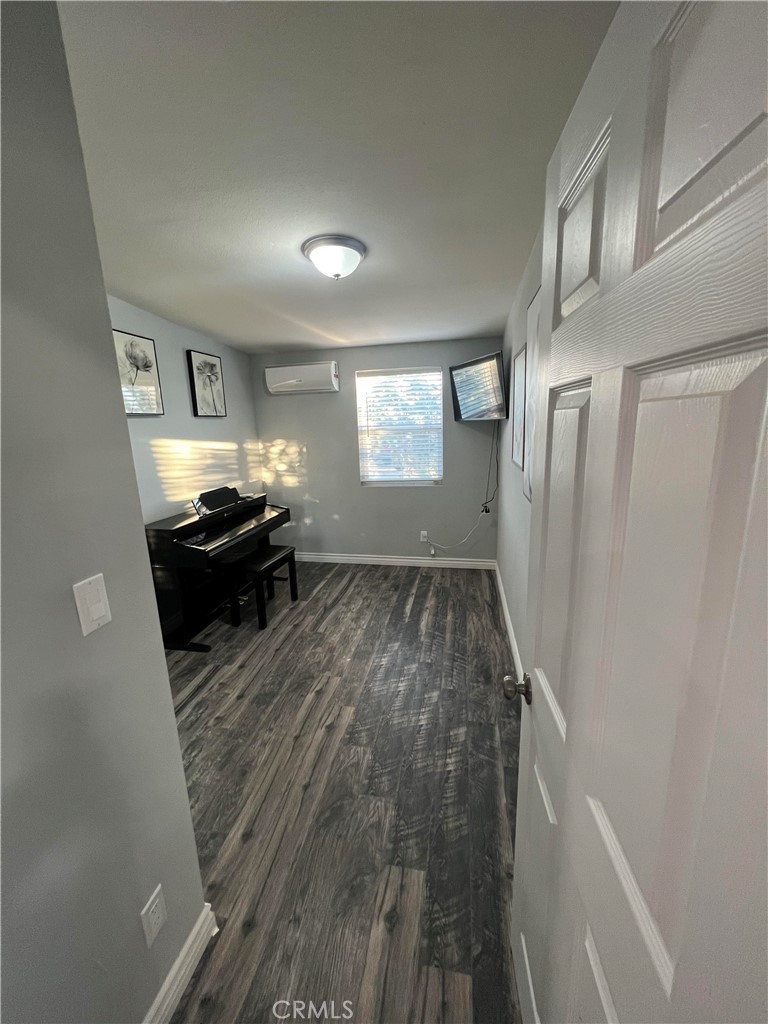 20240 Juniper Road Apple Valley, CA 92308 - Photo 5 of 25 a living room with furniture and a stove top oven