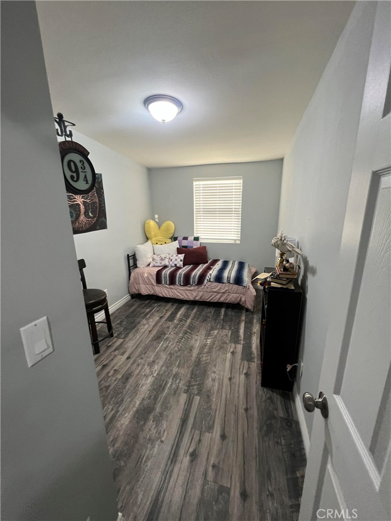 20240 Juniper Road Apple Valley, CA 92308 - Photo 8 of 25 a living room with furniture and a wooden floor