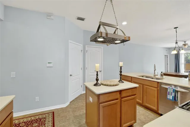 an empty room with furniture and a ceiling fan