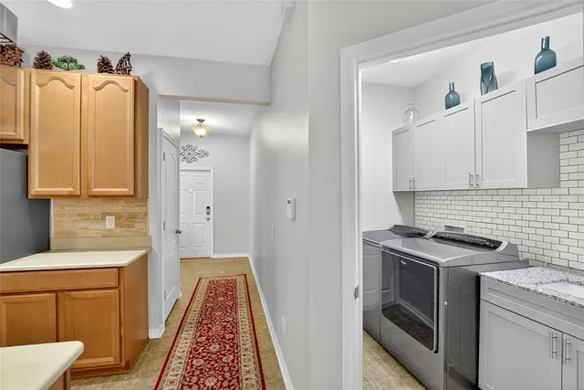 a very nice looking dining room with a table and chairs