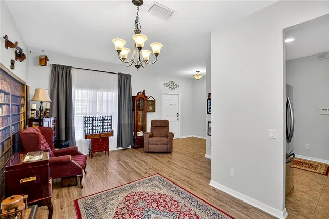 a bedroom with furniture and a book shelf