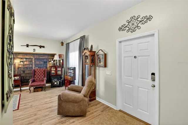 a kitchen with stainless steel appliances a stove refrigerator and cabinets