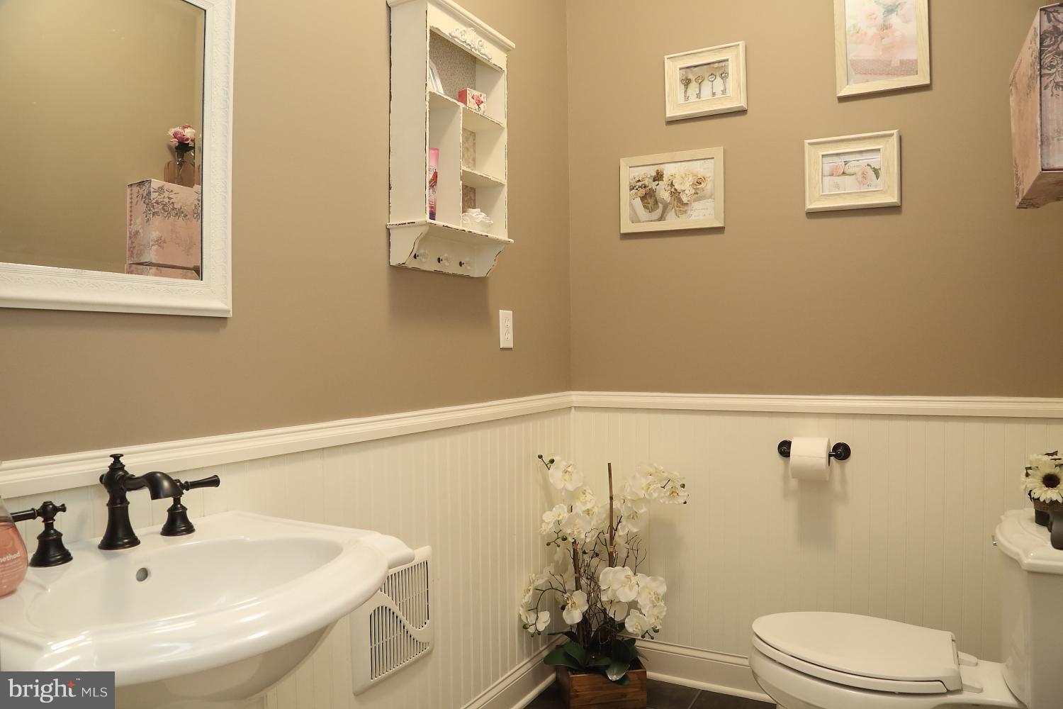 134 River Birch Drive Lititz, PA 17543 - Photo 11 of 27 Downstairs powder room with wainscoting