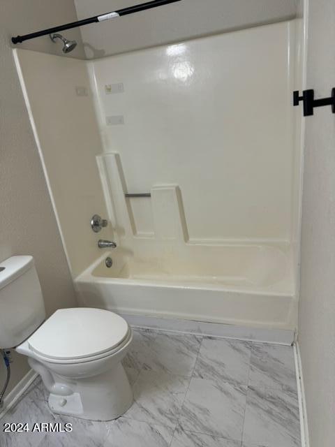 1336 East Mountain View Road, Unit 202 Phoenix, AZ 85020 - Photo 20 of 23 a white toilet sitting next to a bath tub and a shower