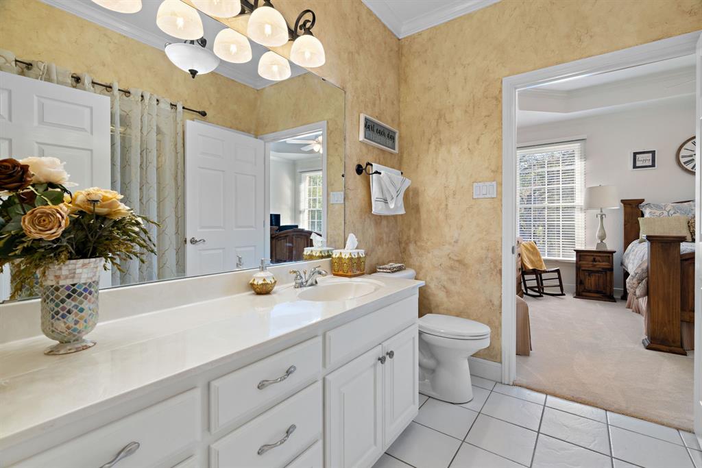 72 Crown Road Willow Park, TX 76087 - Photo 19 of 40 a spacious bathroom with a double vanity sink mirror and toilet