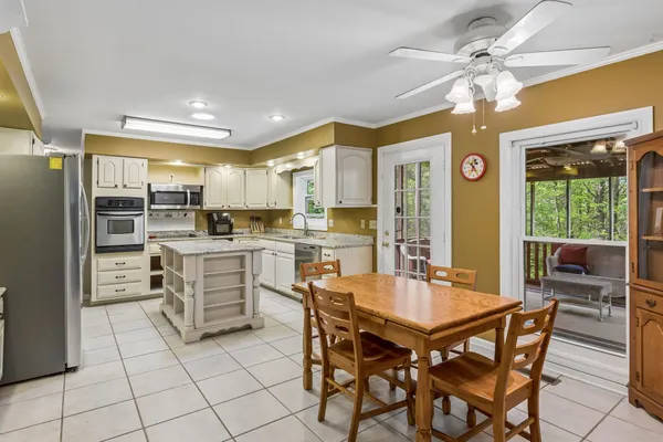 a view of a dining room kitchen and a window