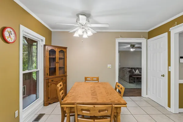a dining room with a table and chairs