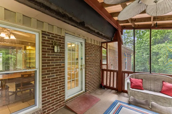 a view of a porch with furniture