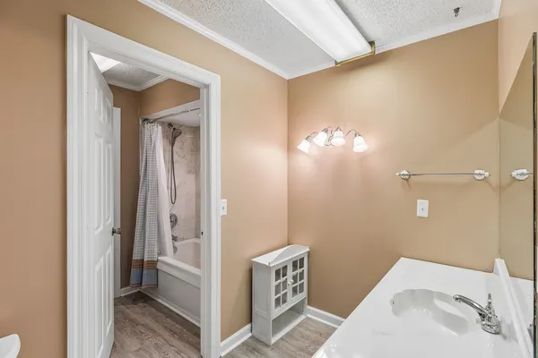 a bathroom with a sink and shower