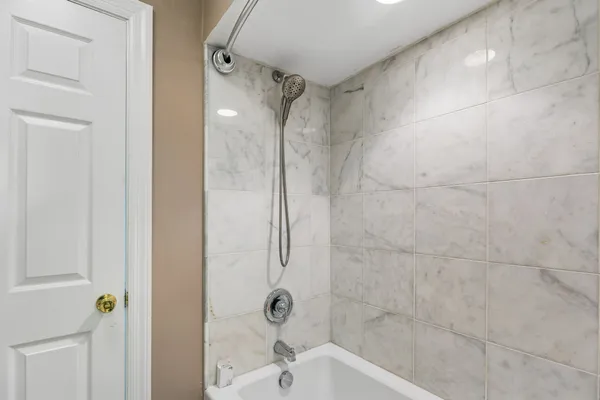 a bathroom with a glass shower door
