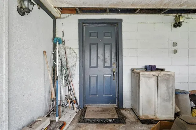 a view of a dining room with furniture and a window