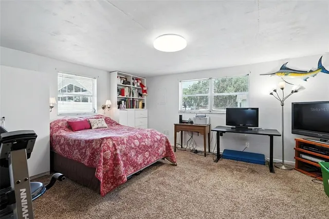a bathroom with a toilet a sink and a window