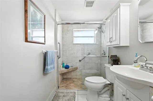 a bed room with a bed and a large window