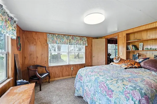 a living room with furniture a fireplace and a chandelier