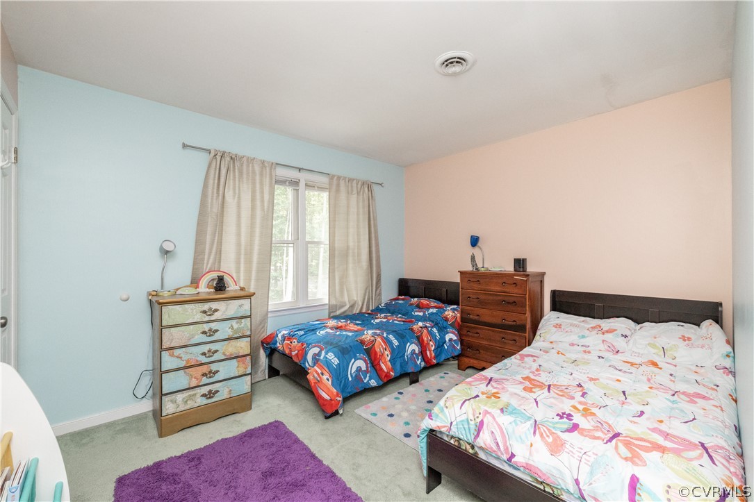5900 Mill Spring Road Midlothian, VA 23112 - Photo 24 of 41 a bedroom with two beds and a dresser