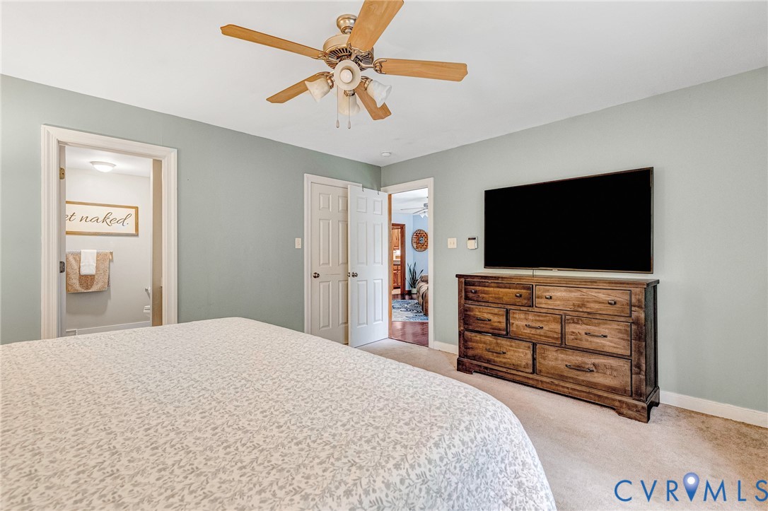 109 Pleasant Grove Court Aylett, VA 23009 - Photo 22 of 39 a bedroom with a bed and a flat screen tv