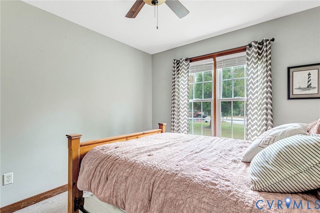 109 Pleasant Grove Court Aylett, VA 23009 - Photo 31 of 39 a bedroom with a bed and a large window
