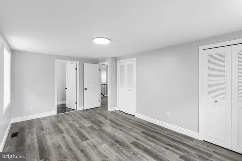 a view of room with wooden floor