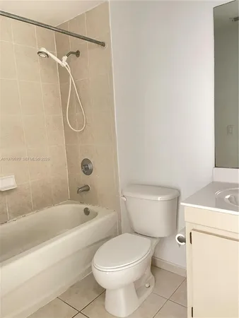 a bathroom with a toilet and a bath tub
