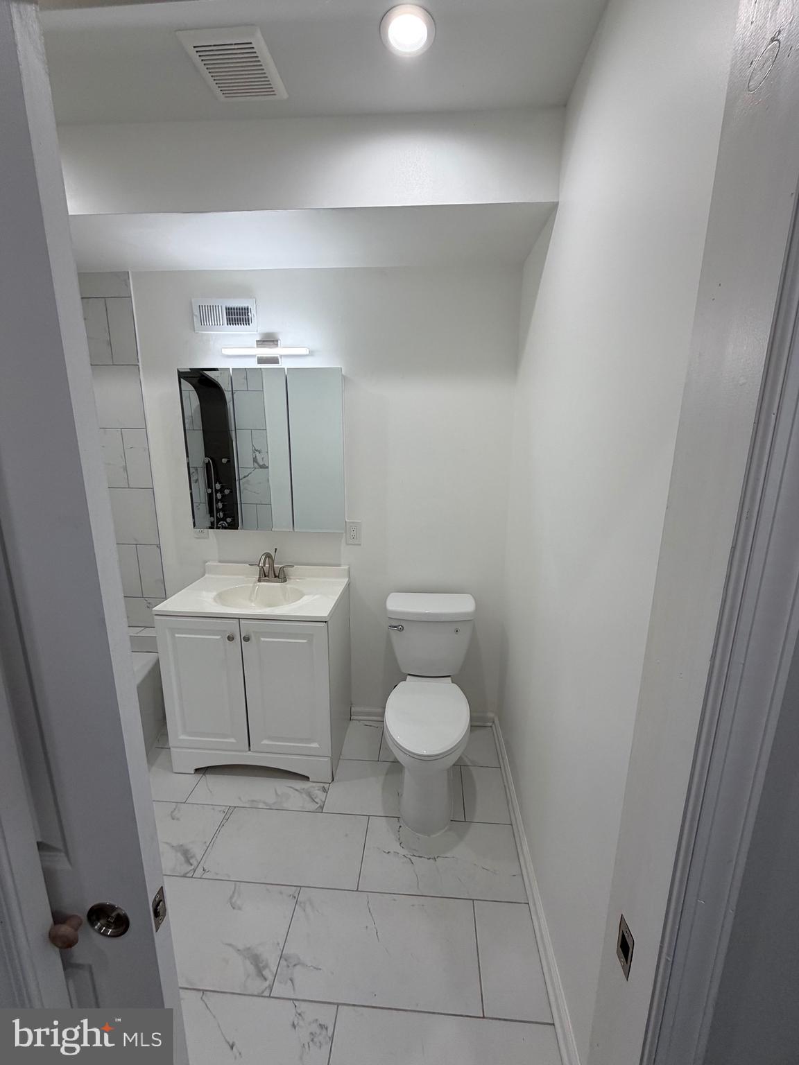 2218 Master Street Philadelphia, PA 19121 - Photo 13 of 66 a bathroom with a sink toilet and mirror