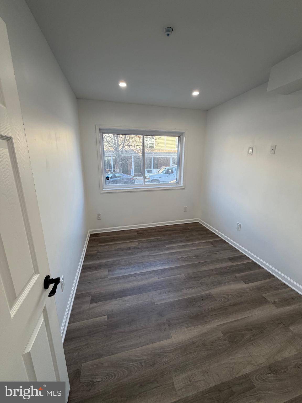 2218 Master Street Philadelphia, PA 19121 - Photo 16 of 66 an empty room with wooden floor and window