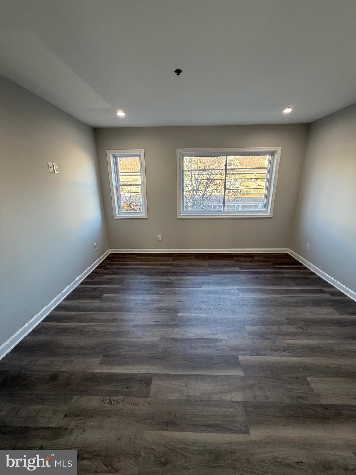2218 Master Street Philadelphia, PA 19121 - Photo 41 of 66 an empty room with wooden floor and windows