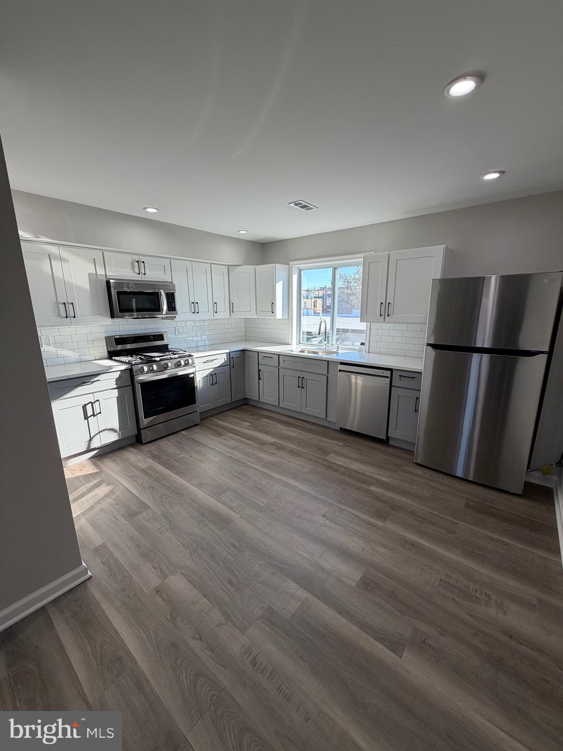 2218 Master Street Philadelphia, PA 19121 - Photo 47 of 66 a kitchen with a refrigerator and a stove top oven