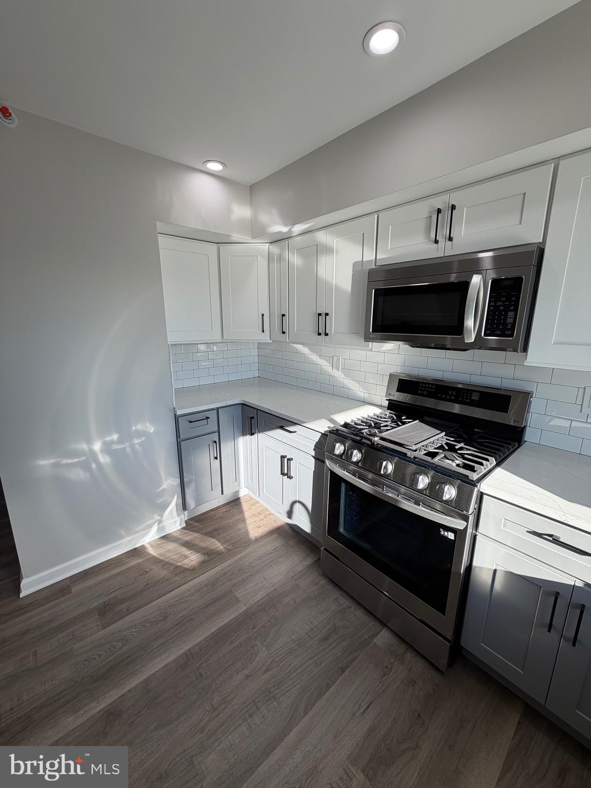 2218 Master Street Philadelphia, PA 19121 - Photo 49 of 66 a kitchen with stainless steel appliances granite countertop a stove and a refrigerator