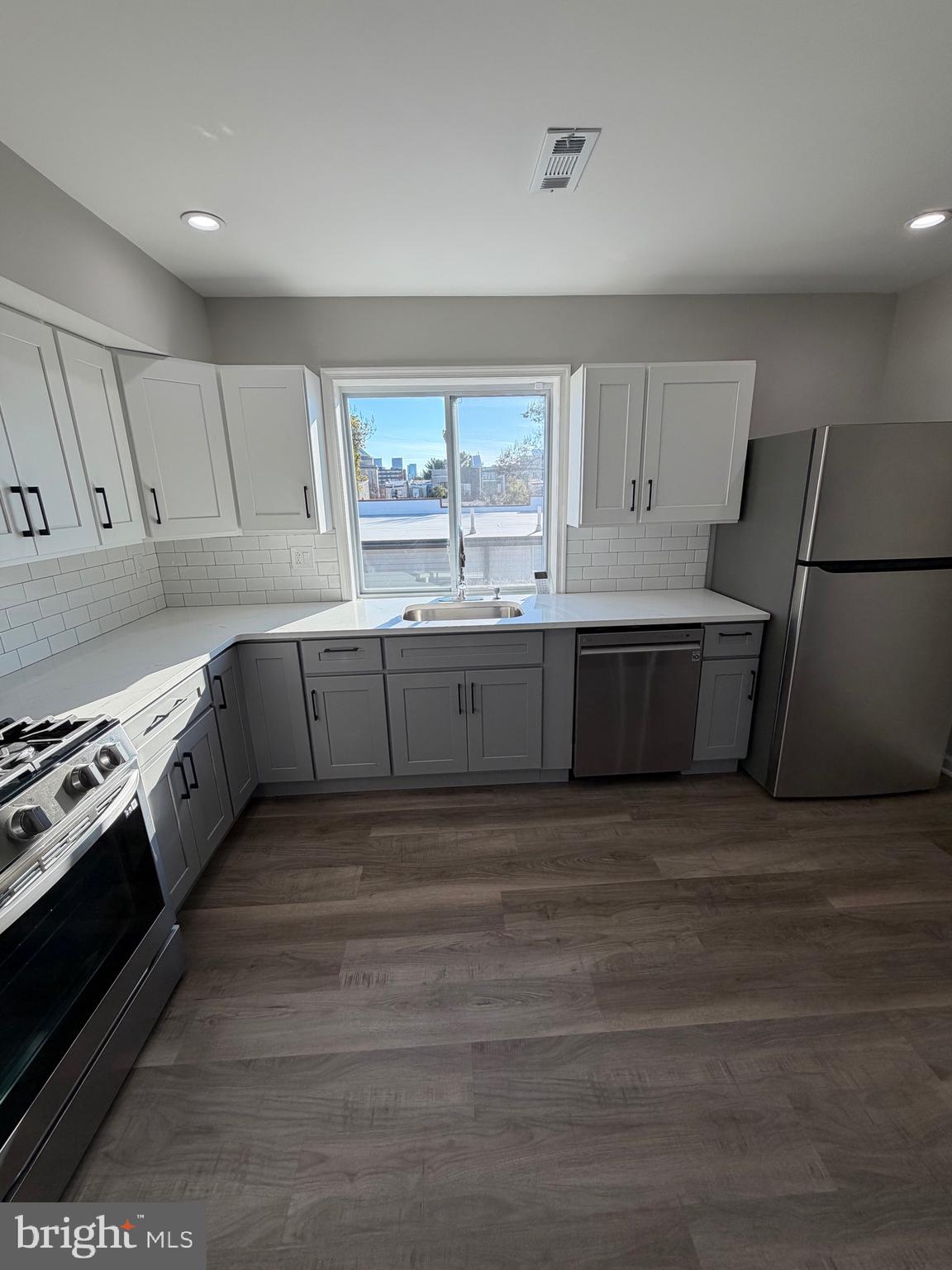 2218 Master Street Philadelphia, PA 19121 - Photo 50 of 66 a kitchen with stainless steel appliances granite countertop a stove and a refrigerator