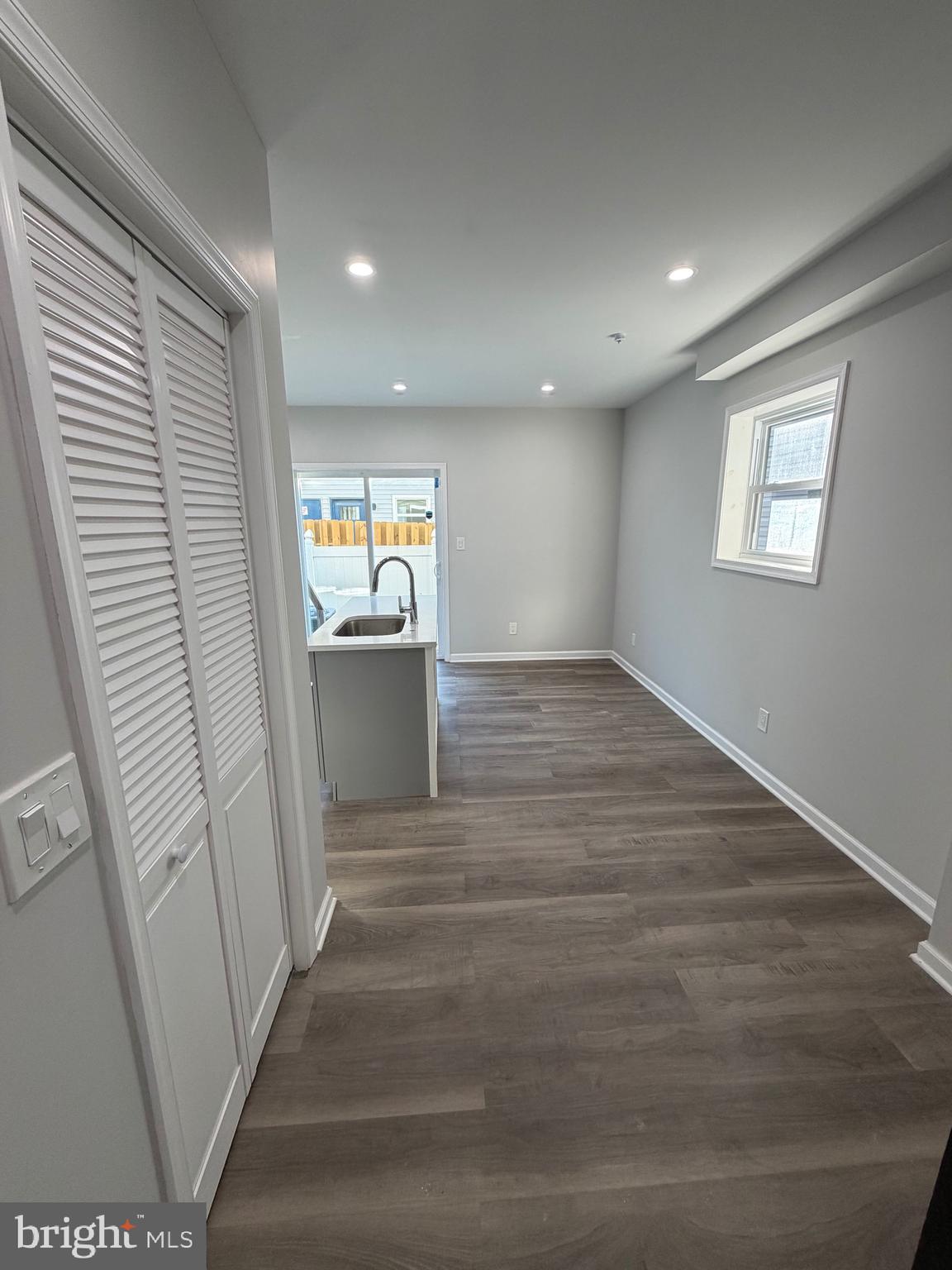 2218 Master Street Philadelphia, PA 19121 - Photo 5 of 66 a view of a hallway to a livingroom and a kitchen with wooden floor