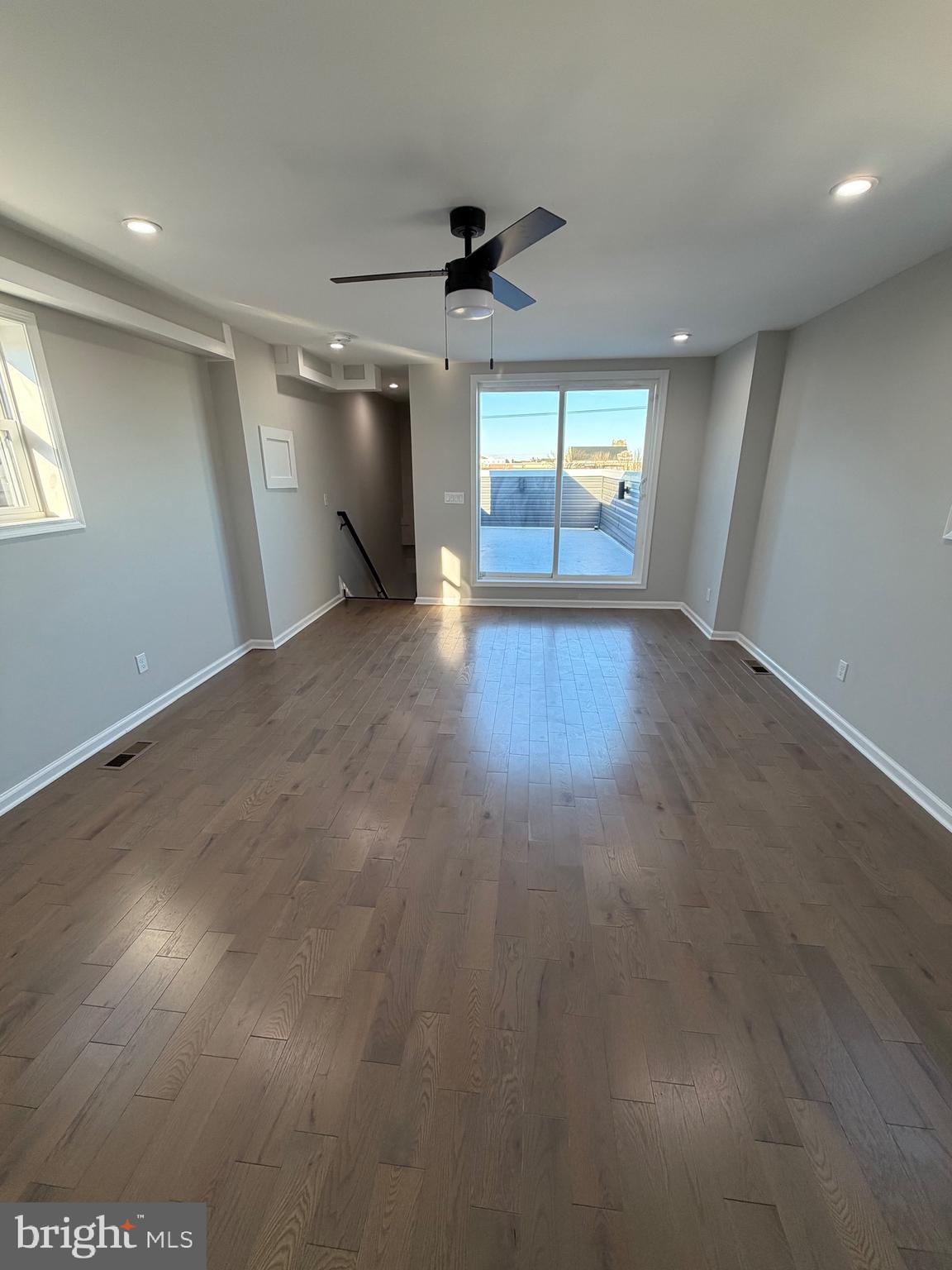 2218 Master Street Philadelphia, PA 19121 - Photo 62 of 66 an empty room with wooden floor cabinet and windows