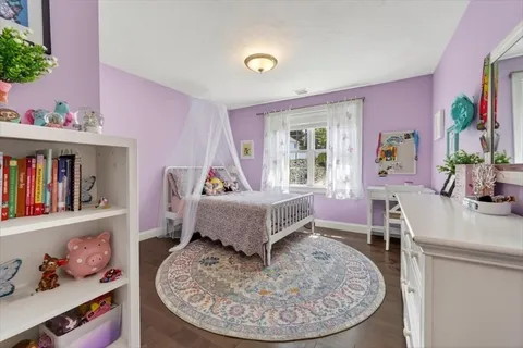 a living room with furniture and a bed