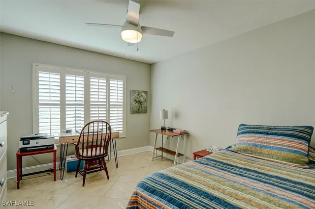a bedroom with furniture and a window