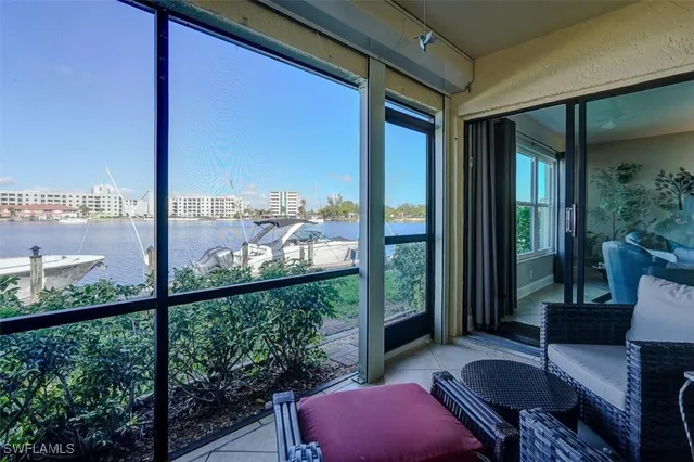 a balcony with furniture and wooden floor