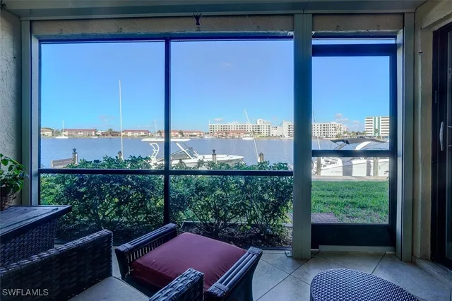 a view of a balcony with couches and wooden floor