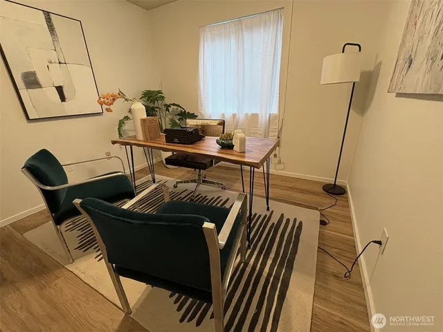 a view of a workspace with furniture