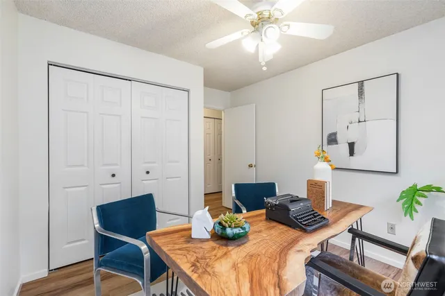 a view of a chairs and table in backyard