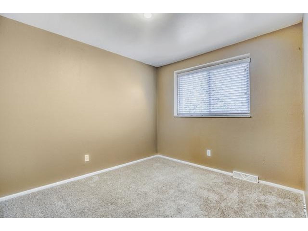 10748 Routt Street Broomfield, CO 80021 - Photo 14 of 30 an empty room with a window