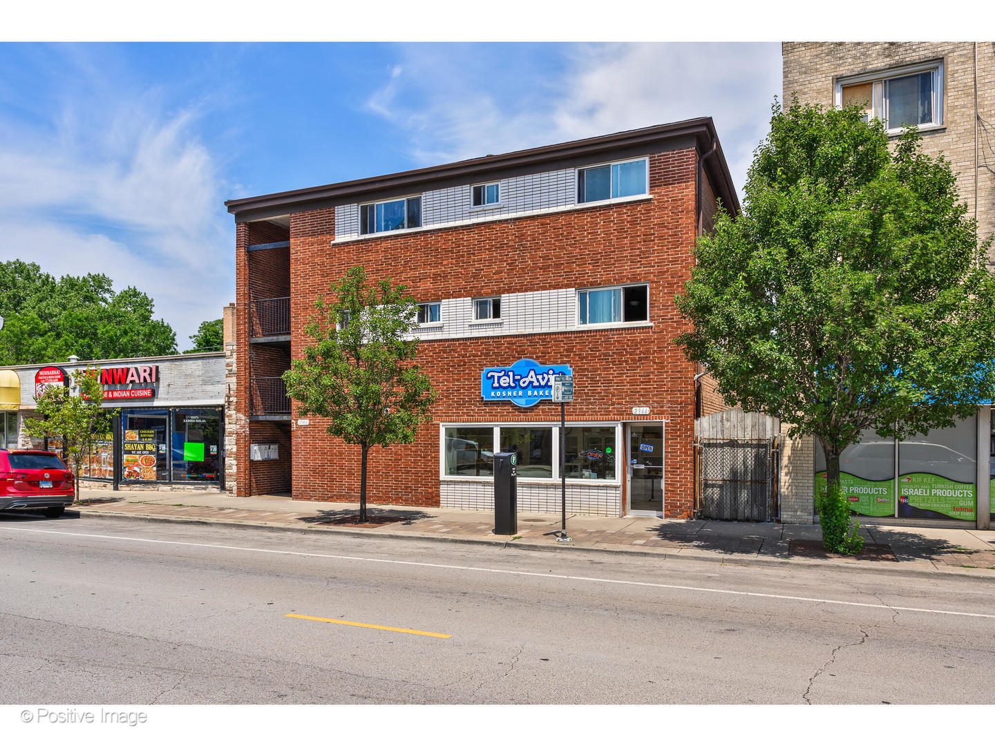 2944 West Devon Avenue Chicago, IL 60645 - Photo 1 of 15 a front view of building with street