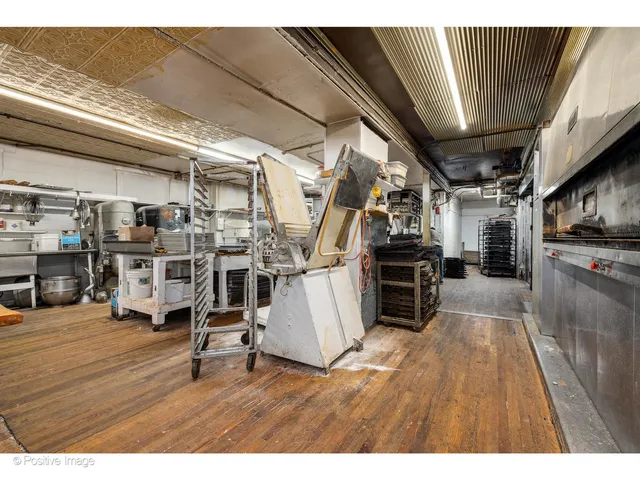 a room with lots of furniture and a view of living room